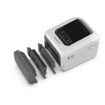 honeywell-pc42e-drukarka-etykiet-biala-z-akcesoriami Drukarka etykiet Honeywell PC42E-D widok z przodu biała z akcesorami